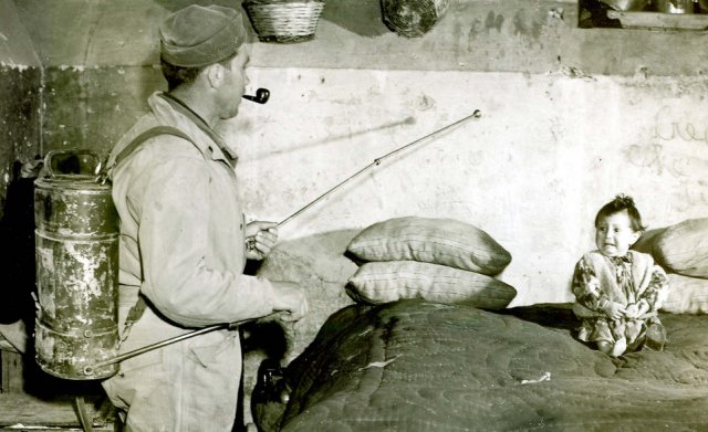 American GI spraying DDT in an Italian home, 1945